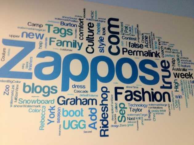 Wall with Zappos logo and other words